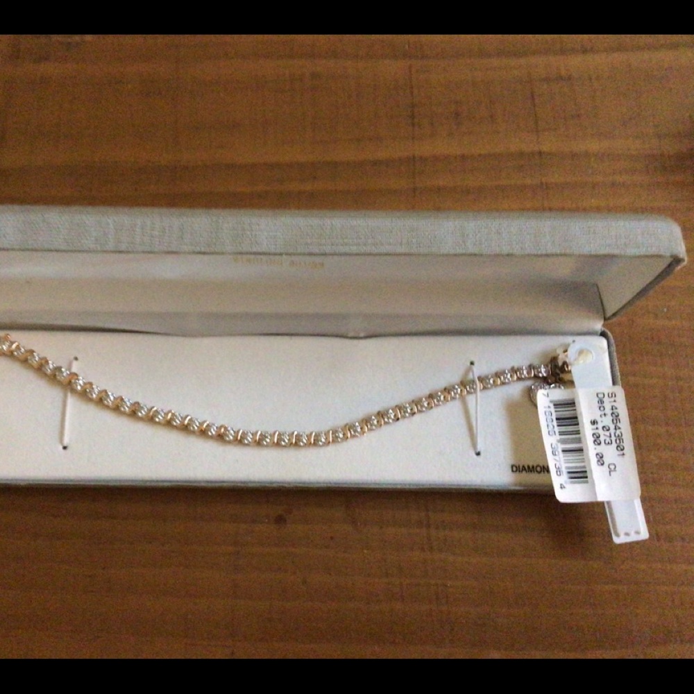 18K GOLD OVER STERLING SILVER TENNIS BRACELET.
